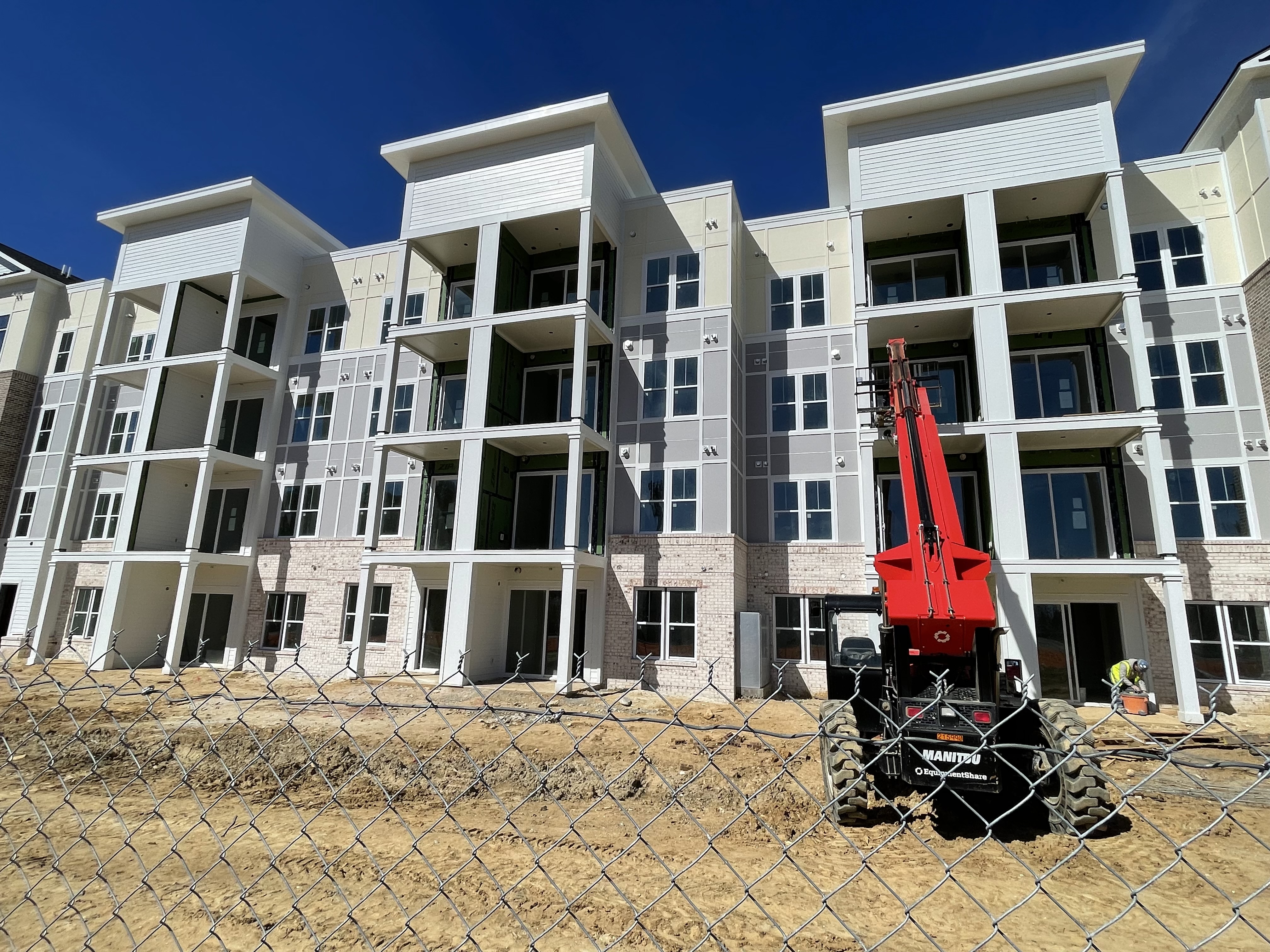 Multifamily apartments with balconies and fiber cement detailing